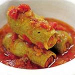 Zucchini stuffed with meat and tomato sauce